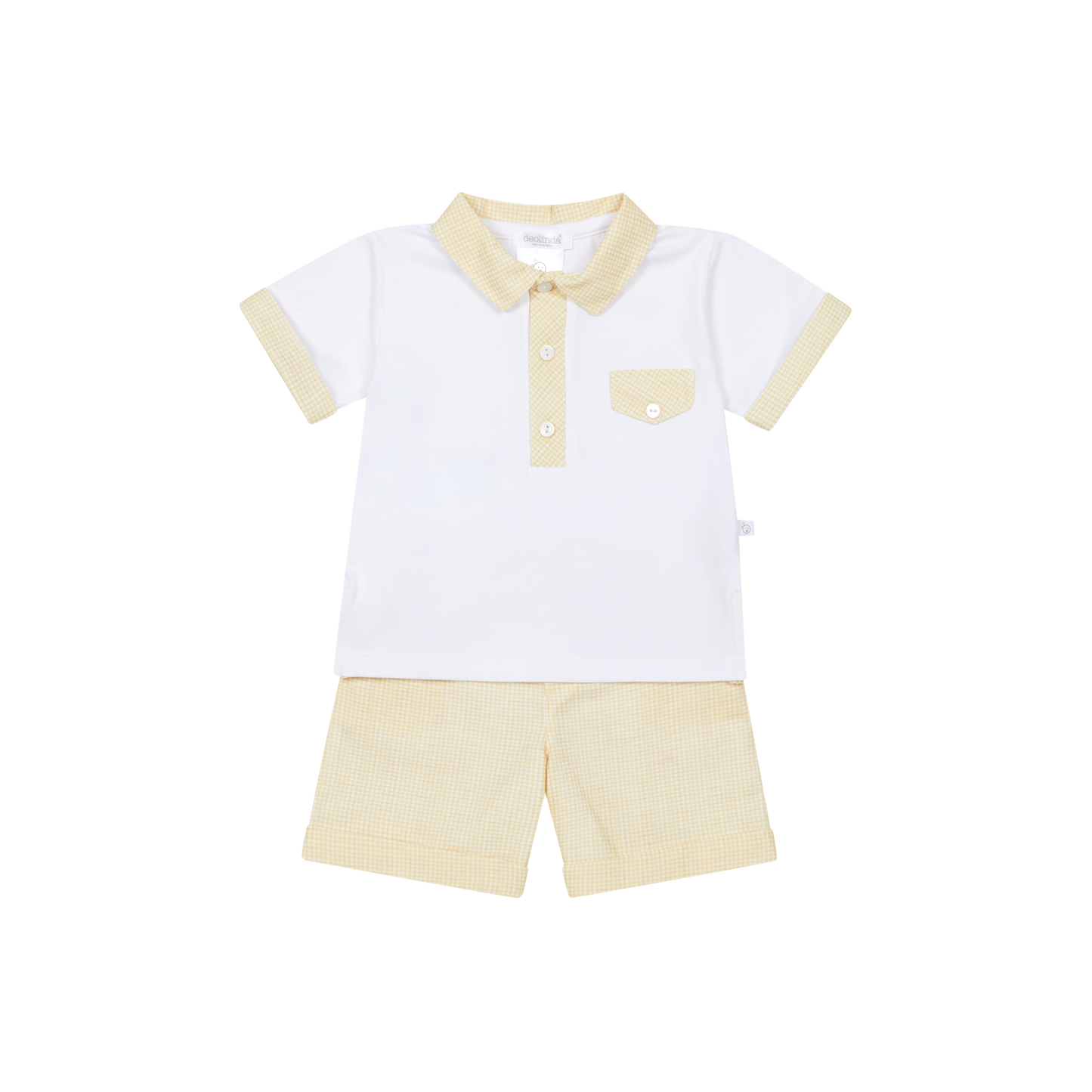 White polo shirt with beige collar and shorts on a white background