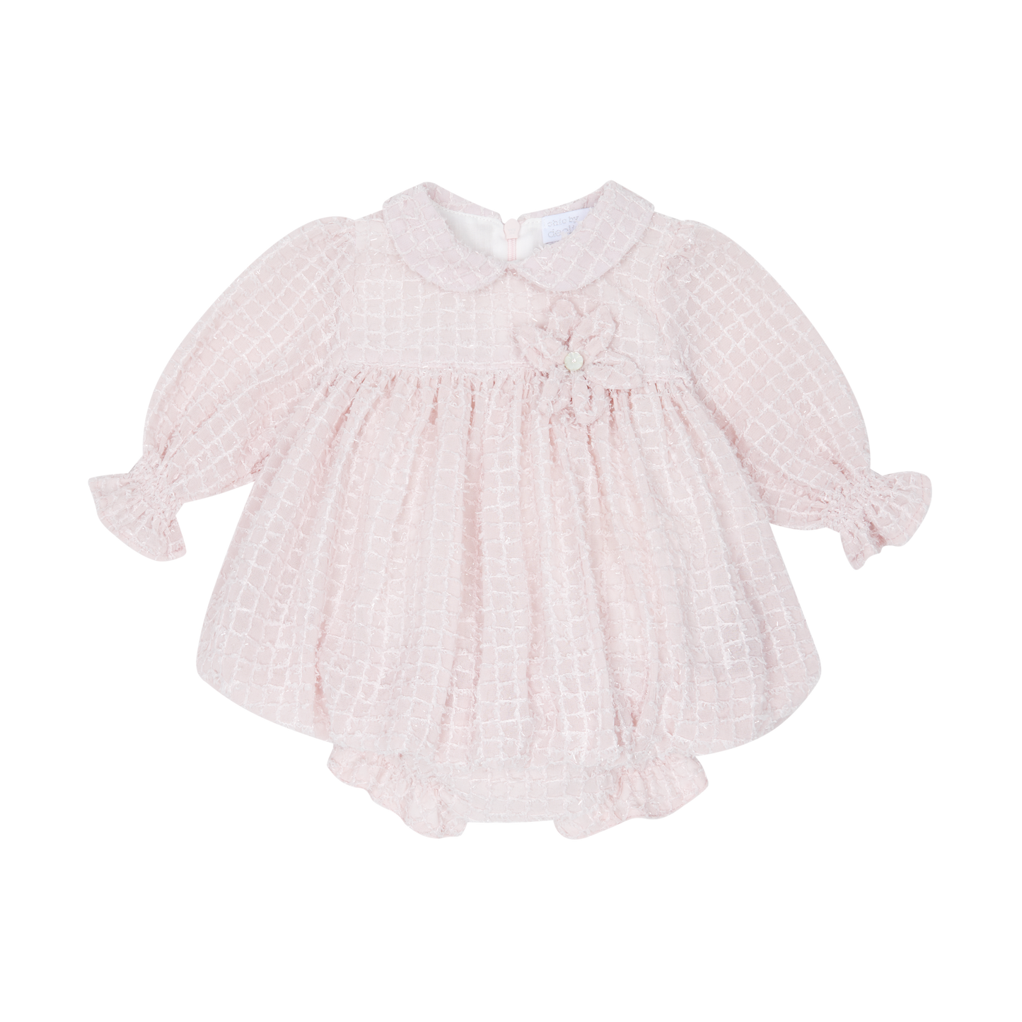 Pink baby dress with ruffled sleeves on a white background