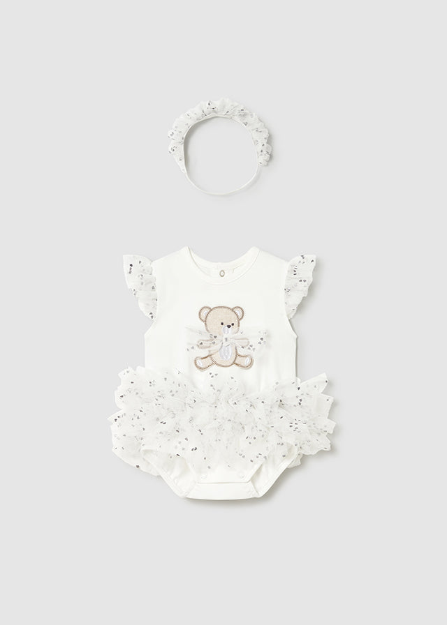 Baby romper with teddy bear design and matching headband on a light gray background