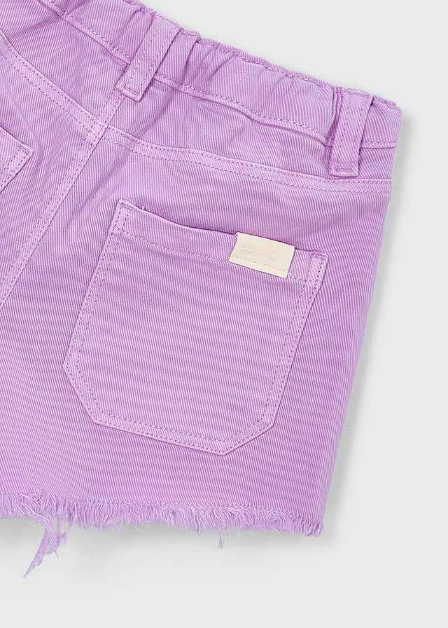Close-up of a purple shorts with a pocket on a light gray background