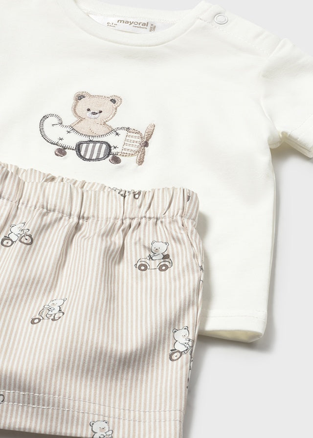 Baby outfit with white long-sleeve shirt and striped pants featuring teddy bear designs on a white background.