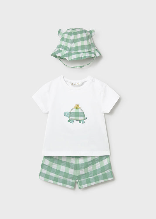 Children's outfit set with t-shirt, shorts, and hat featuring a turtle design on a white background.