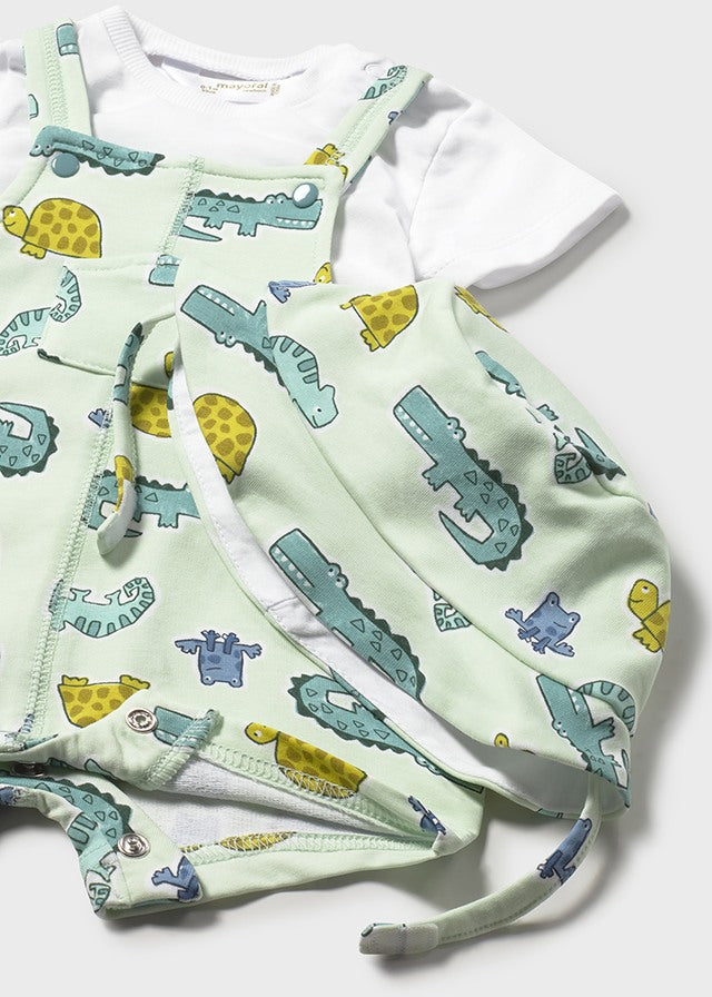 Children's outfit with dinosaur pattern on a white background