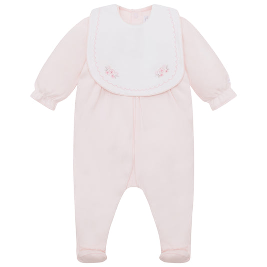 Pink baby onesie with bib on a white background