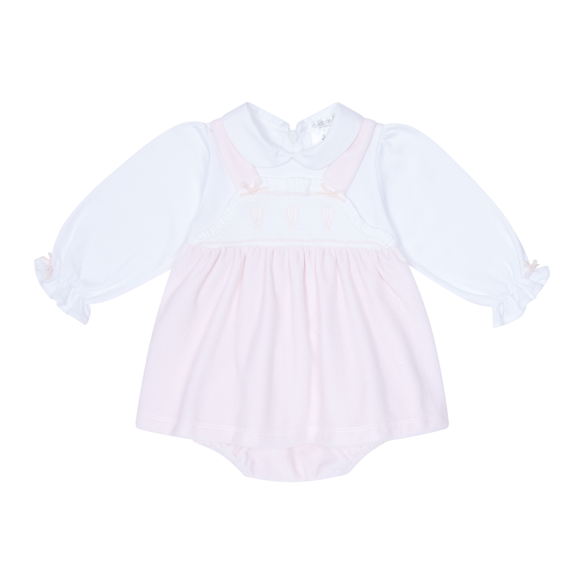 White baby dress with long sleeves on a white background