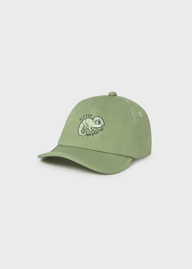 Green cap with a logo on a light gray background
