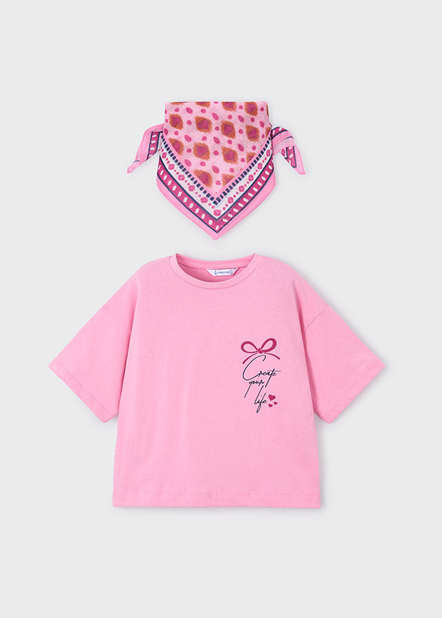 Pink t-shirt with graphic design and matching bandana on a light gray background